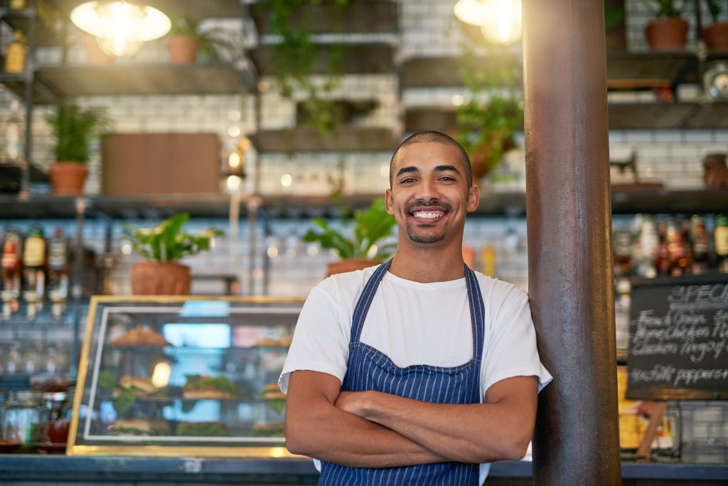 Customers always stop by for some quality service. Portrait of a young entrepreneur standing in his business.