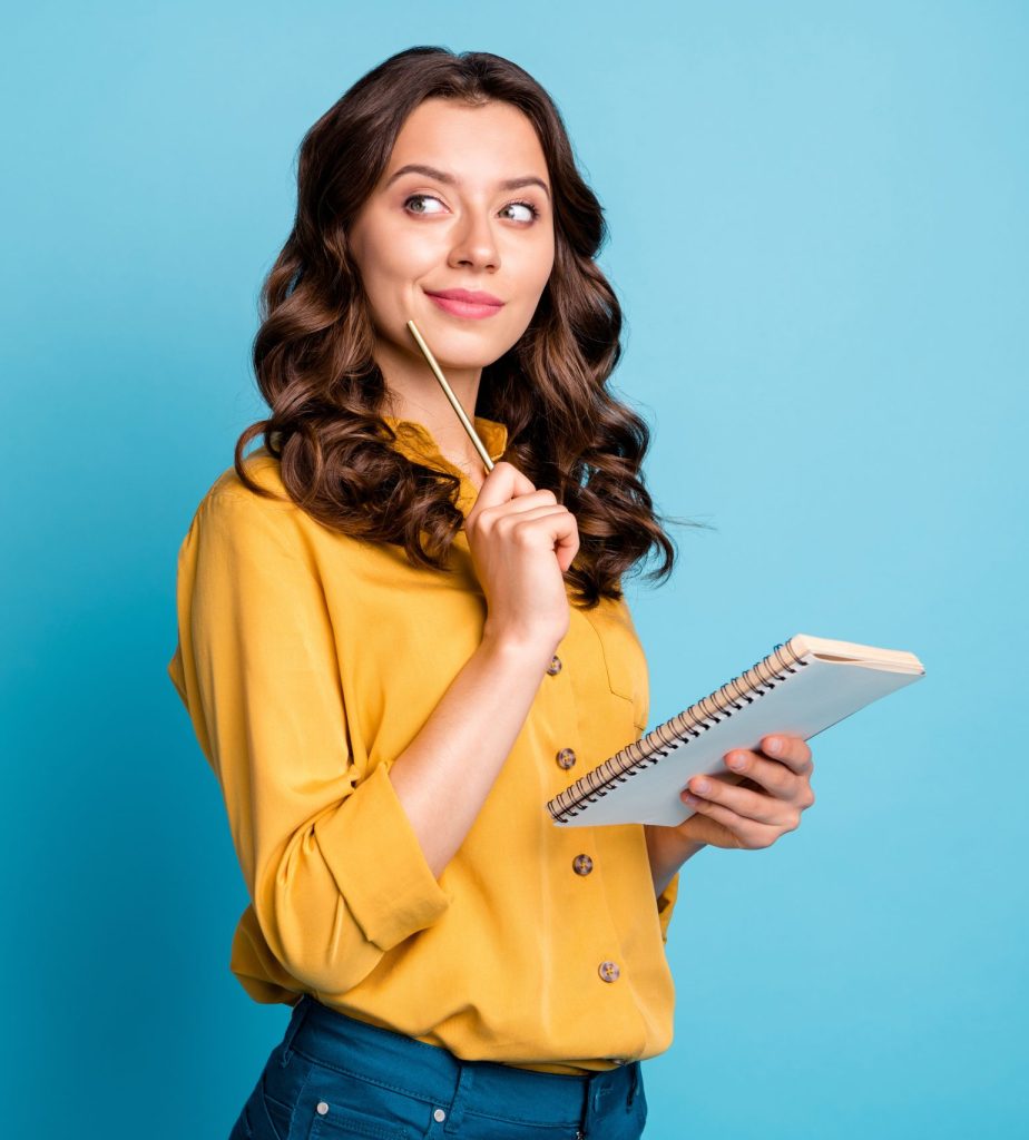 Profile side view portrait of her she nice attractive lovely cheerful curious wavy-haired girl creating notes love story isolated on bight vivid shine vibrant green blue turquoise color background