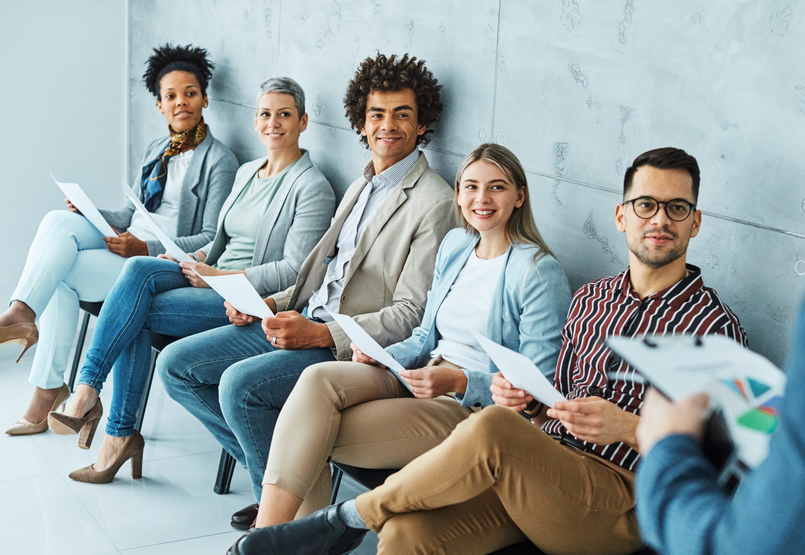 man business chair sitting waiting woman businessman candidate recruitment businesswoman office businessperson job young interview line